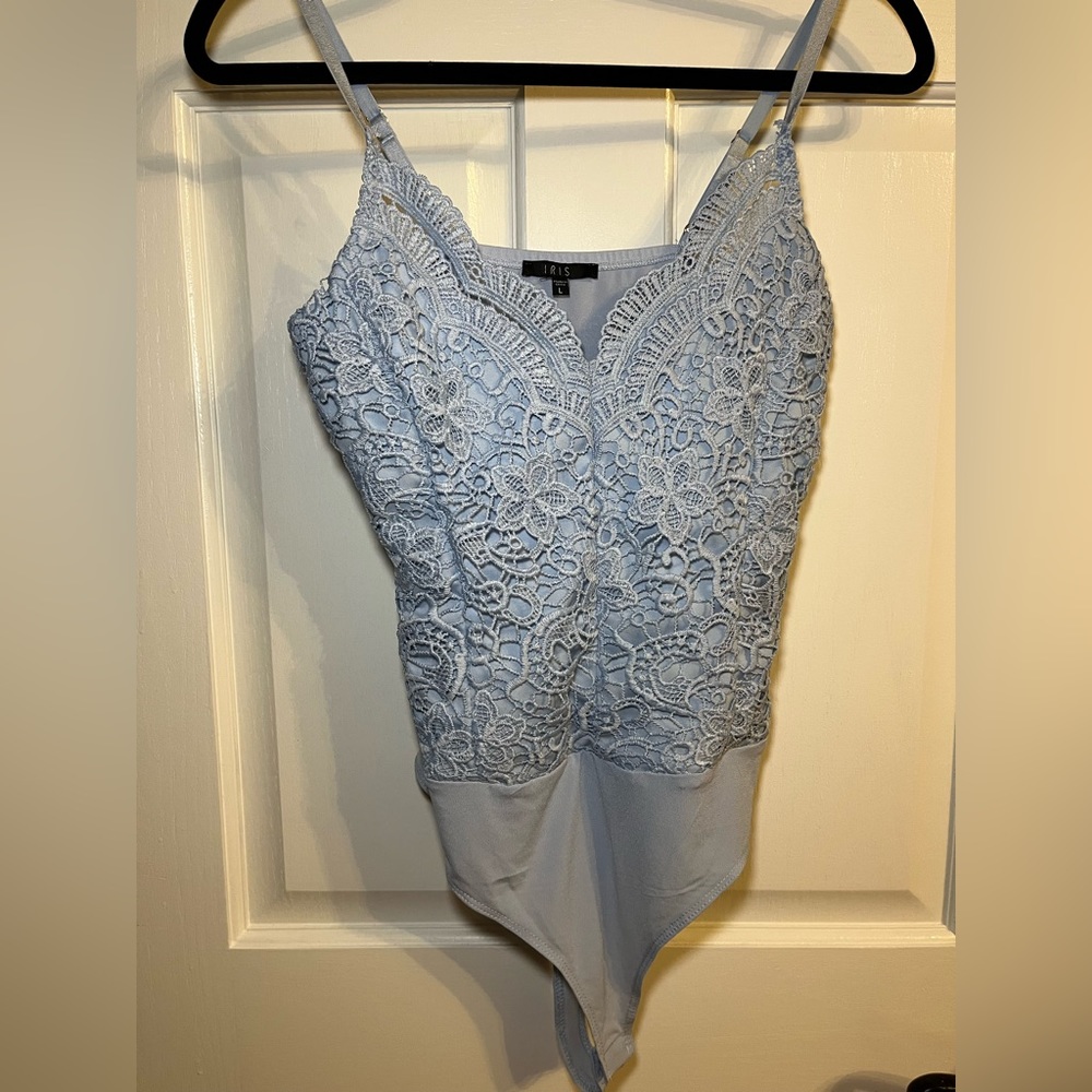 Light blue bodysuit.